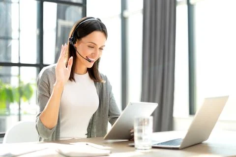 Customer support operator working in a call center office Stock Photos
