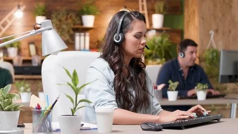 Customer support operators are working in cozy office Stock Footage 112649057