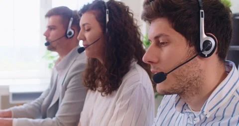 Customer support operators team with headset working in office, call center Stock Footage 334191912