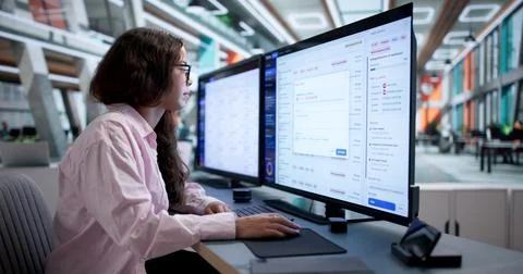 Customer Support Specialist Carefully Tracking Help Desk Tickets Using Digita Stock Photos