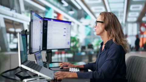 Customer Support Specialist Efficiently Manages AI Chatbot Software Stock Footage 346928979
