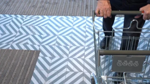 The customer takes a trolley from the row Stock Footage 152473883