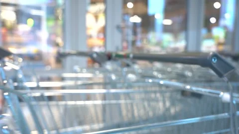 The customer takes a trolley from the row Stock Footage 156993987