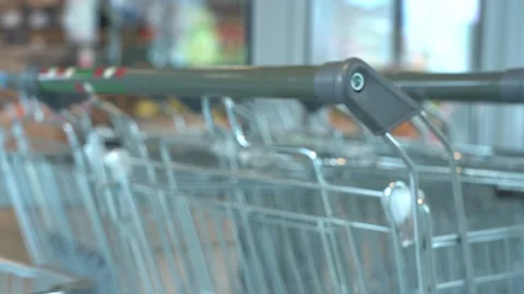 The customer takes a trolley from the row Stock Footage 167931084
