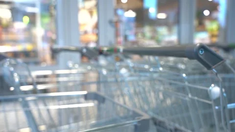 The customer takes a trolley from the row Stock Footage 167931207