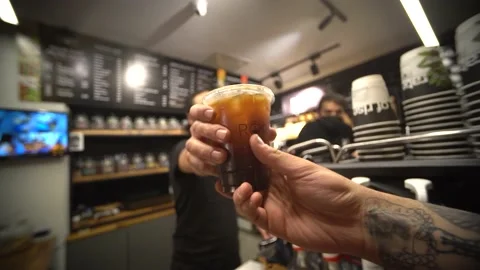 Customer taking her coffee from the barista 4K Slow Motion Stock Footage 180698690