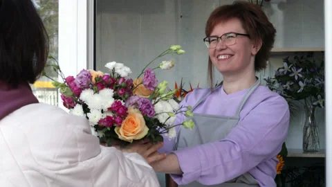 Customer taking an order in flower shop. Stock Footage 182369599