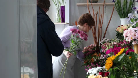 Customer taking an order in flower shop. Stock Footage 192416338