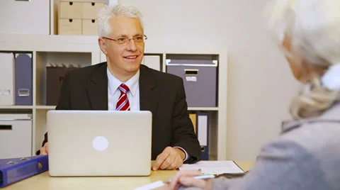 Customer talking to businessman in office Stock Footage 34624700