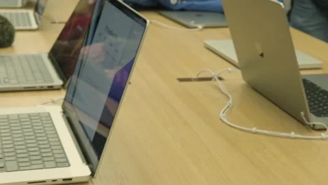 Customer testing new Macbook tablet in apple sales office in Germany, produ.. Stock Footage 232515407