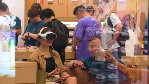 Customer Tests Apple Vision Pro Mixed Reality Headset: Hong Kong Apple Store Video stock 306922182