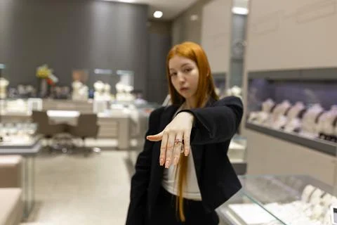 Customer Trying On Pink Gemstone Ring in Jewelry Boutique Stock Photos