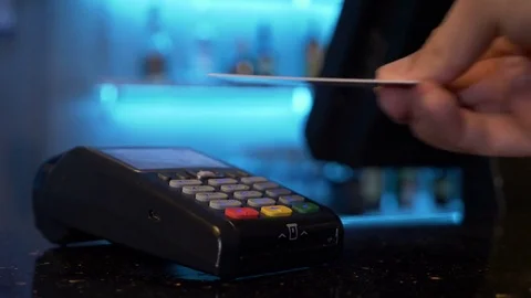 Customer using credit card over pos module for cashless contactless payment f Video stock 81259758