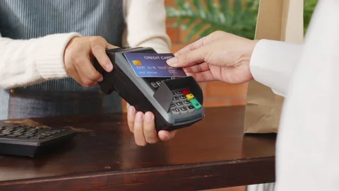 Customer using credit card for payment to owner at cafe restaurant, cashless Stock Footage 147162222