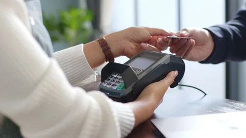 Customer using credit card for payment to owner at cafe restaurant, cashless Stock Footage 147525408