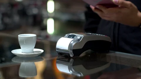 Customer using mobile payment coffee with credit transaction in caf Stock Footage 116522108