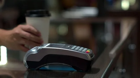 Customer using mobile payment with credit transaction in caf Stock Footage 116521962