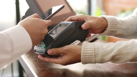 Customer using phone for payment at cafe restaurant, cashless technology Stock Footage 147149846