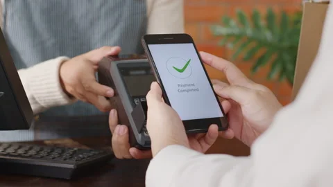 Customer using phone for payment at cafe restaurant, cashless technology Stock Footage 147161589