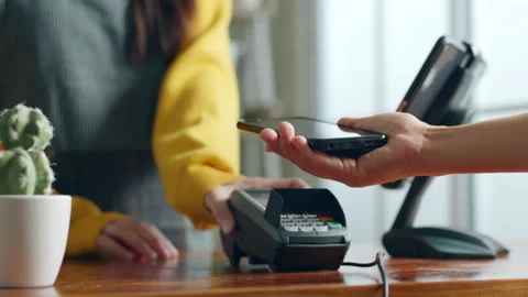 Customer using phone for payment at cafe restaurant, cashless technology Stock Footage 196901269