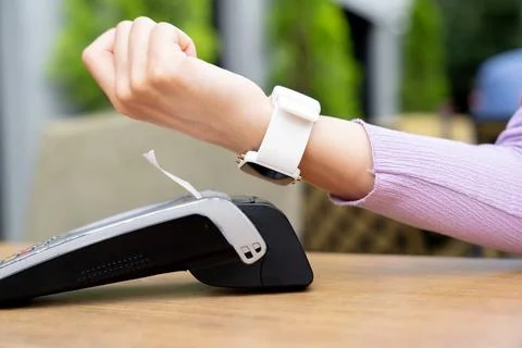 Customer using smart watch to pay. Stock Photos