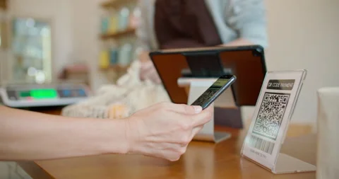 Customer using smartphone contactless payment at zero waste plastic free shop. Stock Footage 201930109