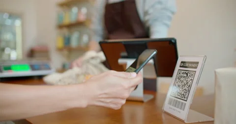 Customer using smartphone contactless payment at zero waste plastic free shop. Stock Footage 233785215