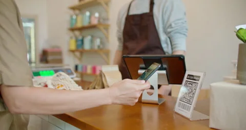 Customer using smartphone contactless payment at zero waste plastic free shop. Stock Footage 240137624