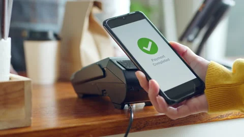Customer using smartphone for NFC payment at cafe restaurant, cashless Stock Footage 196902361