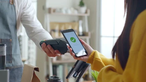 Customer using smartphone for NFC payment at cafe restaurant, cashless Stock Footage 196902553