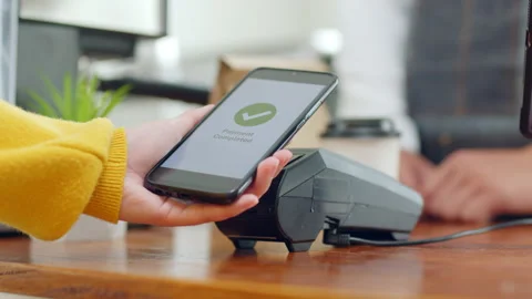 Customer using smartphone for NFC payment at cafe restaurant, cashless Stock Footage 196902735