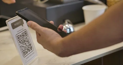 Customer using smartphone for scanning QR payment. Video stock 118103443