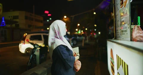 Customer Waiting for Her Ramly Burger in Miri, East Malaysia Stock Footage 147838389