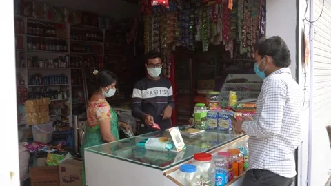 Customer wearing mask doing digital payment protection Covid 19 Corona virus Video stock 130375414