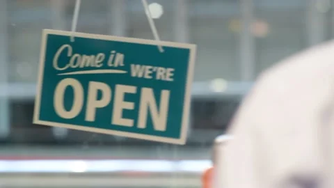 Customer wearing protective face mask entering shop united kingdom Stock Footage 141465590