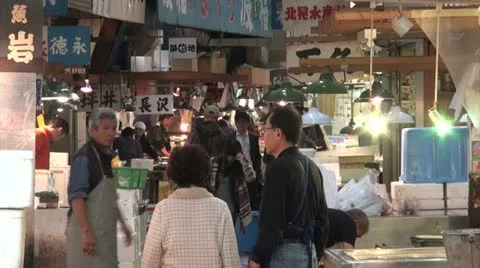 Customers and traders at the Tsukiji fish market in Tokyo, Japan Stock Footage