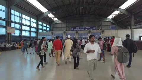Customers are standing in line at the ticket office inside Railway Station Stock Footage 313152489