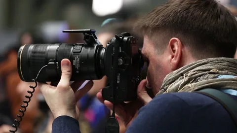 Customers are testing the Nikon camera and lenses Stock Footage 88561459