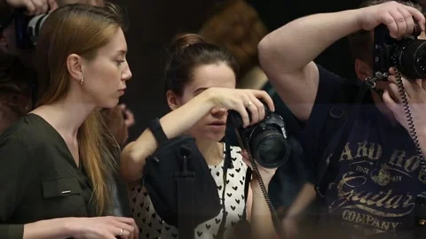 Customers are testing the Nikon camera and lenses Stock Footage 88561524