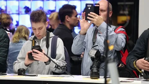 Customers are testing the Nikon camera and lenses Stock Footage 88561610