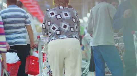 Customers with carts on queue in supermarket Stock Footage 11990770
