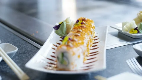 Customers eating sushi in Japanese Asian restaurant Stock Footage