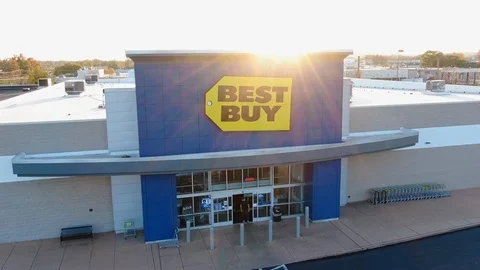 Customers exit Best Buy electronics retail store during sunset, aerial view Stock Footage