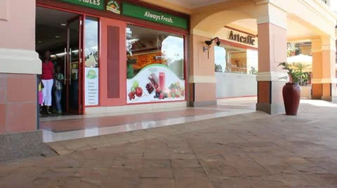 Customers Exit Vegetable Shop in Nairobi Mall   (HD) Stock Footage 12999061