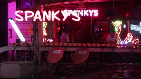 Customers in front of go go bar red light district Vidéo 12253323
