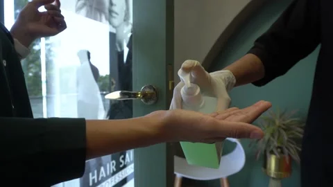 Customers Hands disinfected using hand sanitizer, prevent spread Covid 19 corona Video stock 130180637