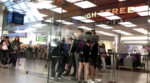 Customers line up outside of the Apple Store to buy the just released iPhone 7 Stock Footage 67602559