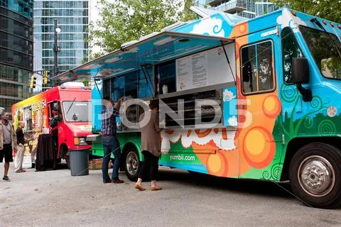Customers order meals from colorful atlanta food truck Stock Photos