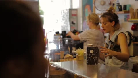 Customers Ordering and Collecting Takeaway Drinks at Cafe Counter in Sydney Stock Footage 345691337