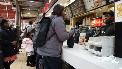 Customers ordering fast food at a Burger King restaurant in London, UK Stock Footage 104111456